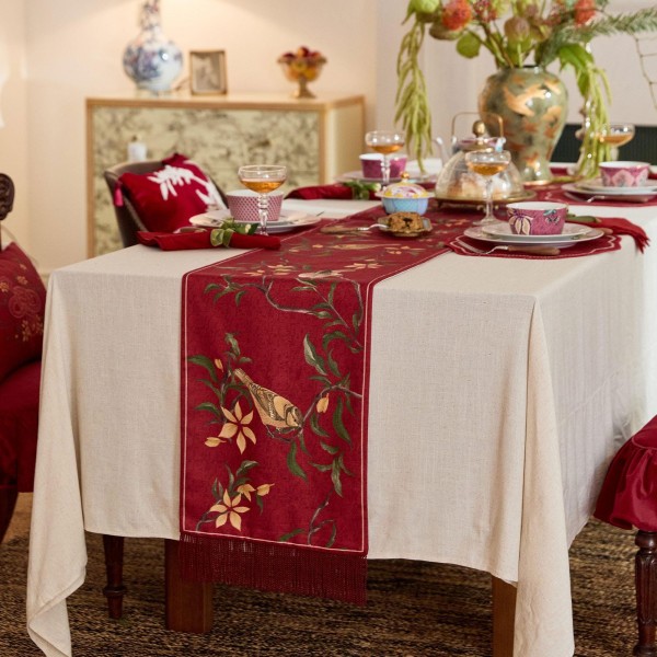 Red table runner with bird and flower pattern