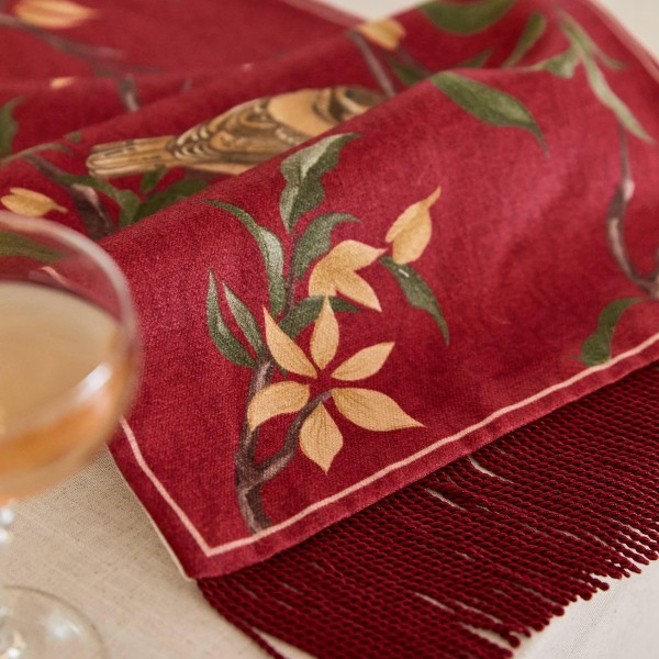 Red table runner with bird and flower pattern