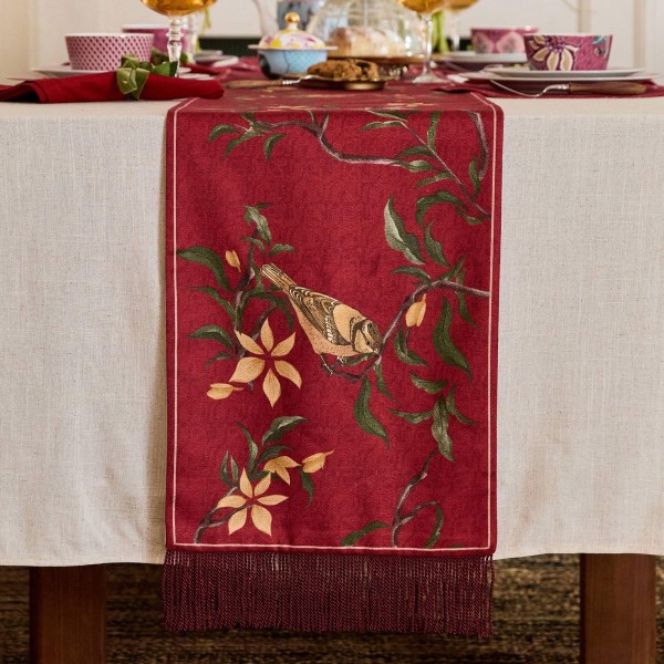Red table runner with bird and flower pattern