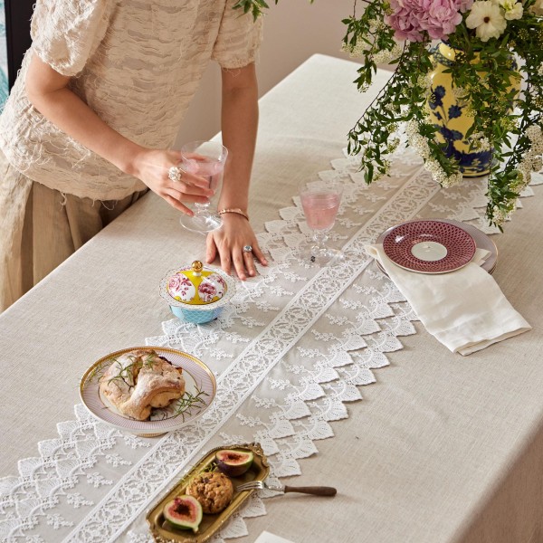 White cotton lace table runner with cutout details