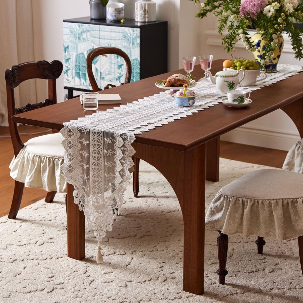 White cotton lace table runner with cutout details