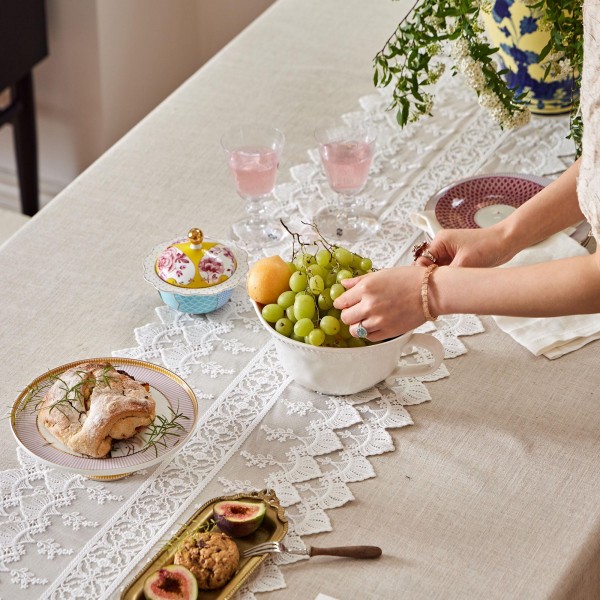 White cotton lace table runner with cutout details